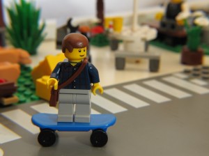 LEGO_Minifigure_skating_through_town